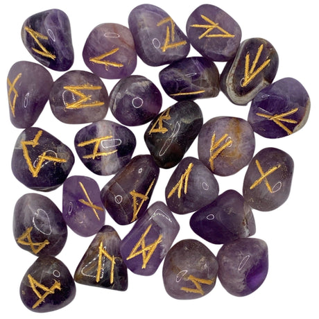 Purple amethyst stones with gold runes engraved on them.