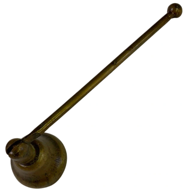 Antique brass candle snuffer with a long handle and a round tip.