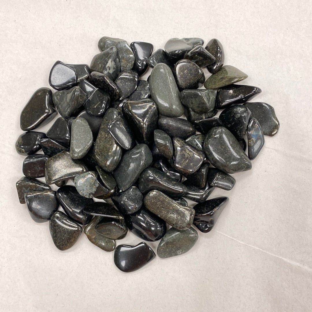 Smooth, polished black jade gemstone with a deep, lustrous sheen.