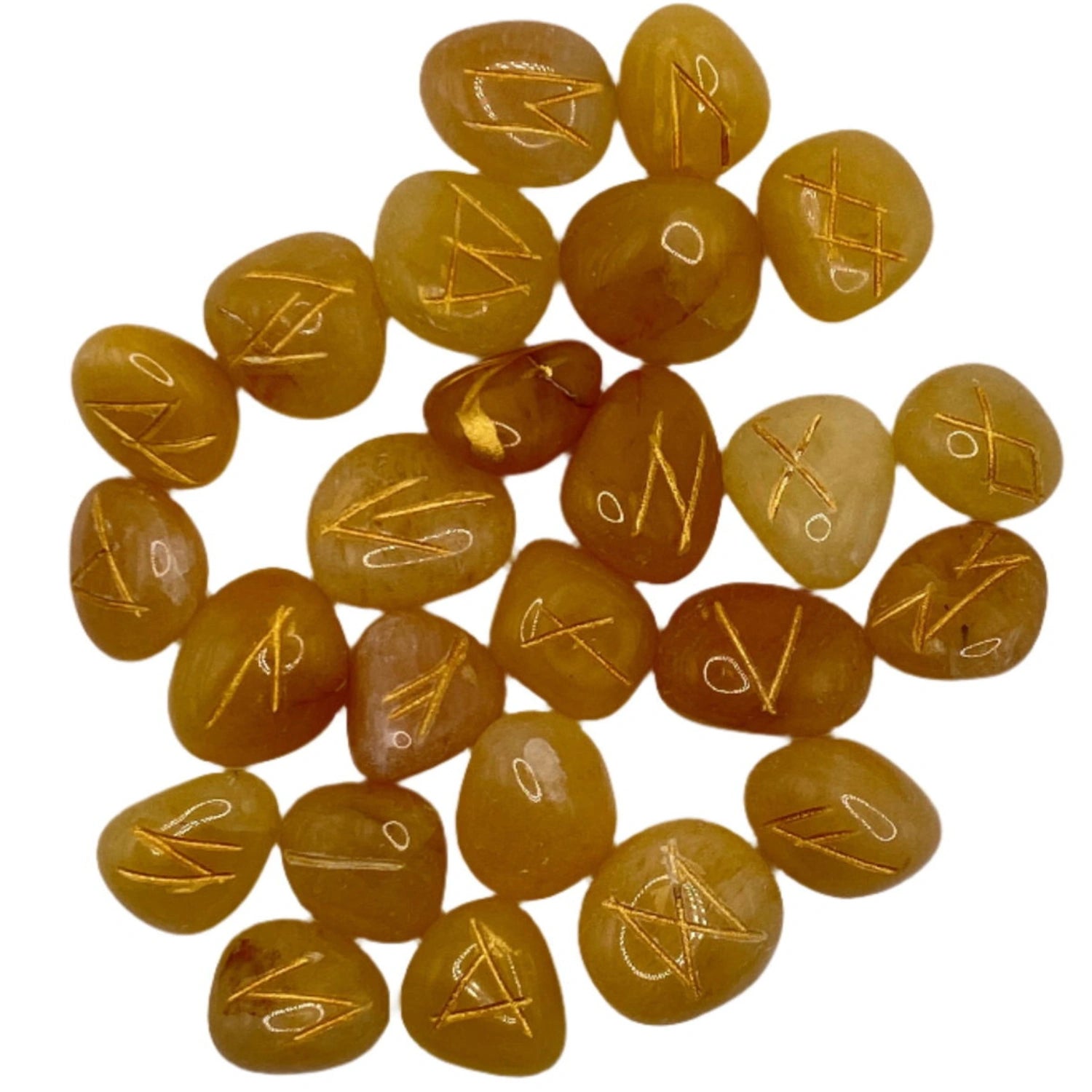 Yellow carnelian stones with gold runes engraved on them.