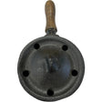 Cast iron incense burner with a wooden handle and holes for air flow.