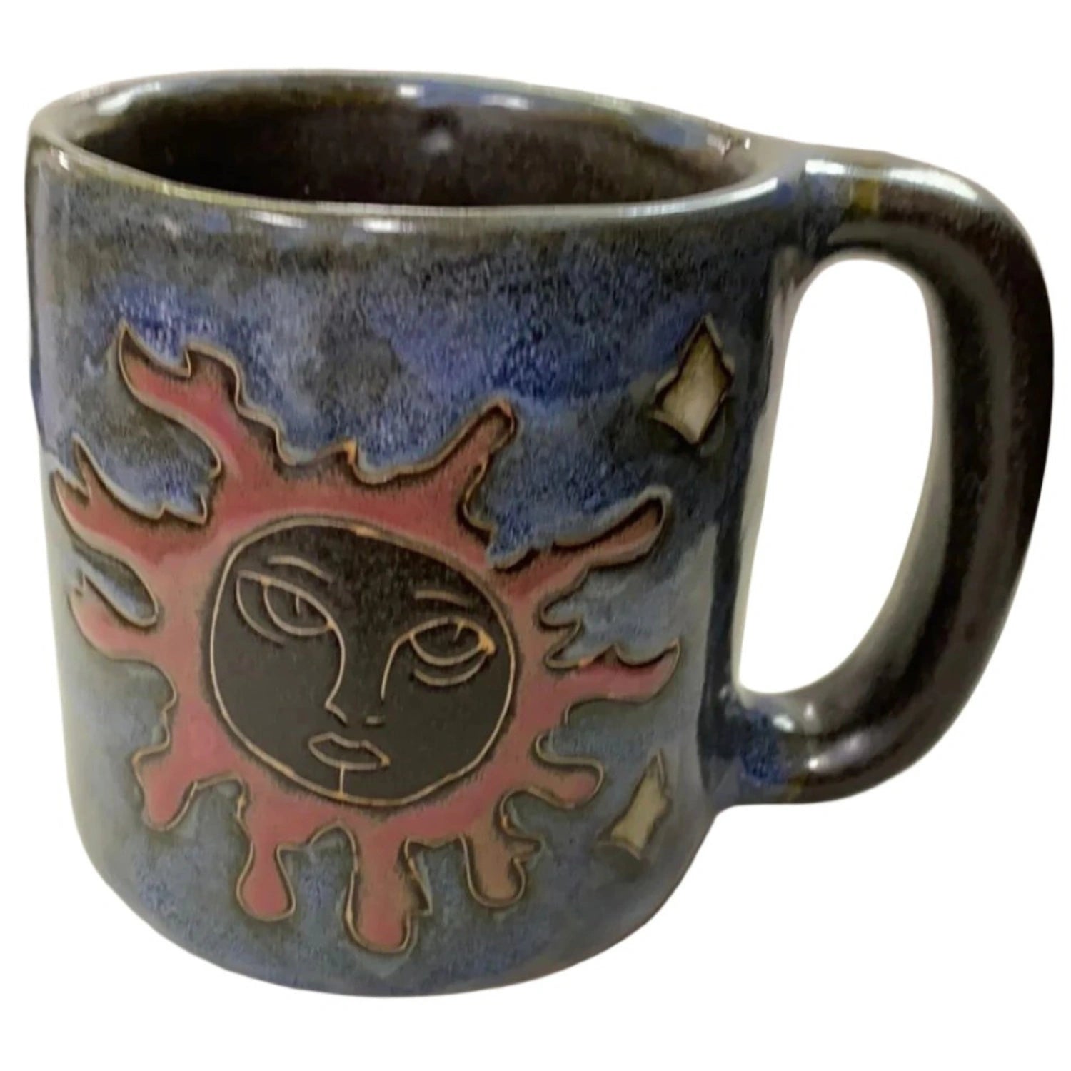 Ceramic mug with a sun design.