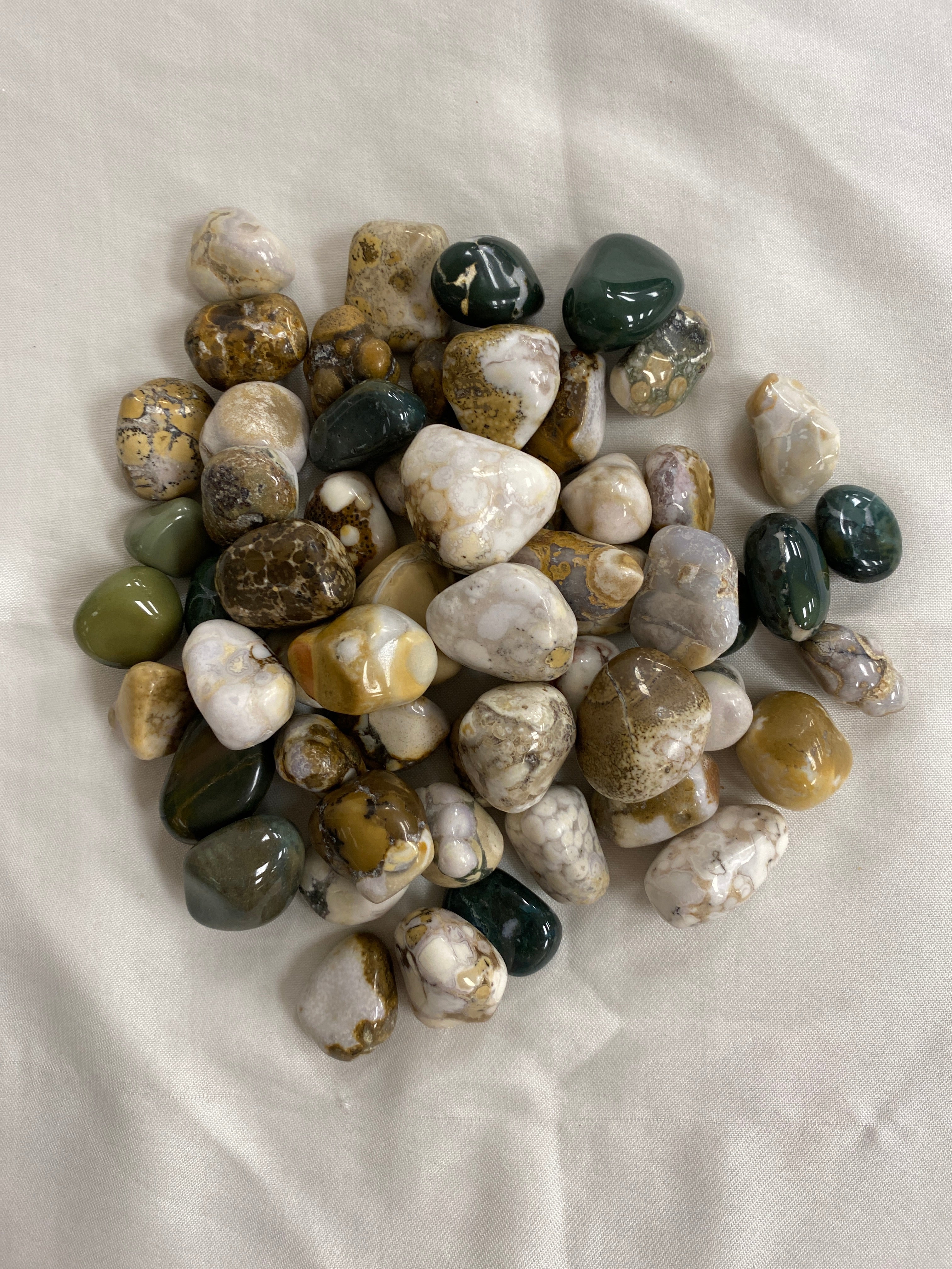 Several polished cobra jasper stone, a symbol of the guardian spirit, encouraging courage, self-discovery, and overcoming challenges.