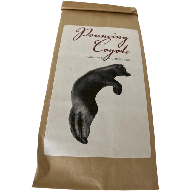 Pouncing Coyote Graphite Drawing Instrument in brown paper bag.