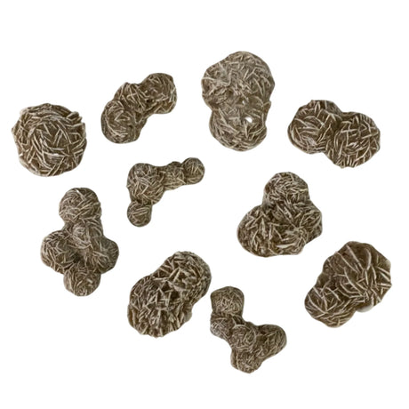 Tumbled Desert Rose stones with a unique, flower-like structure and a smooth, polished finish. The stones vary in size and shape, with shades of brown and white.