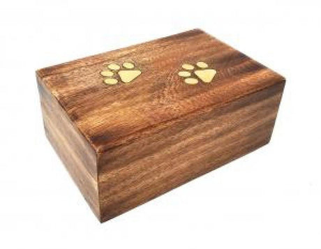 Wooden urn with brass paw prints.