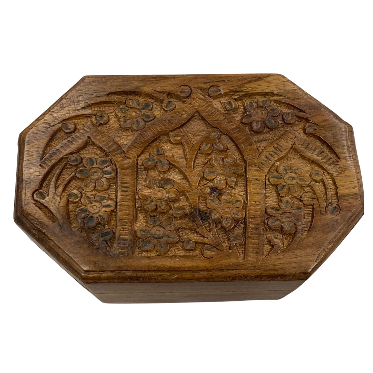 Wooden box with intricate floral carvings.