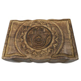 Wooden box with carved Hamsa hand and floral motifs.