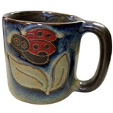 Stoneware mug with ladybug design.