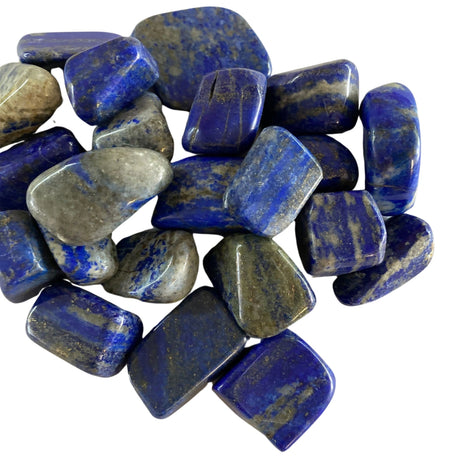 Tumbled Lapis Lazuli stones with a smooth, polished finish and a vibrant blue color with flecks of gold pyrite.