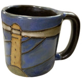 Stoneware mug with lighthouse design.