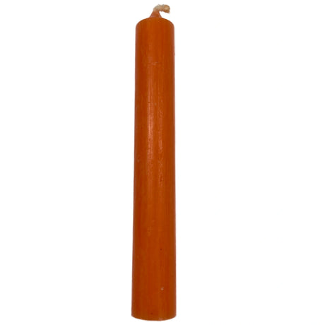 Orange pillar candle with a smooth, unadorned surface.