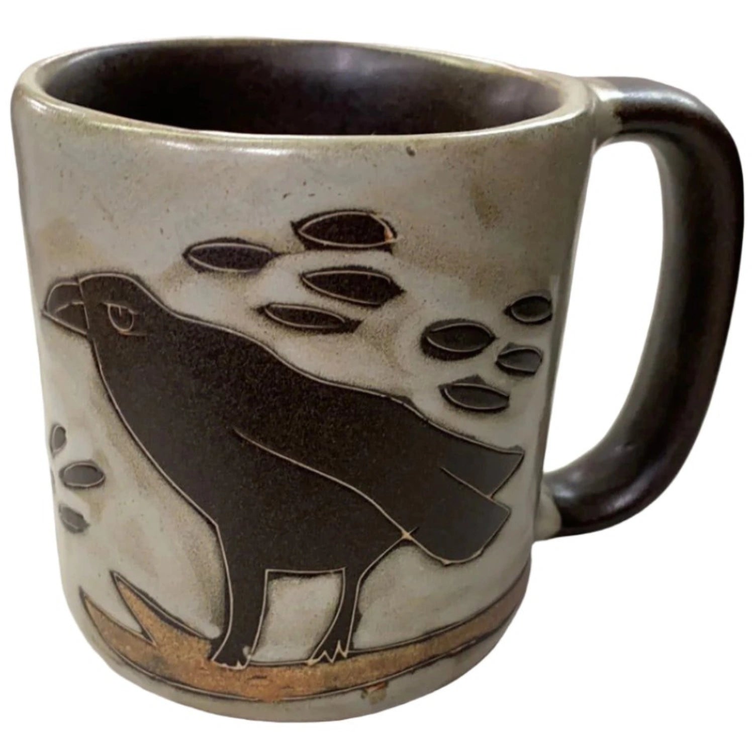 Stoneware mug with a black raven design.