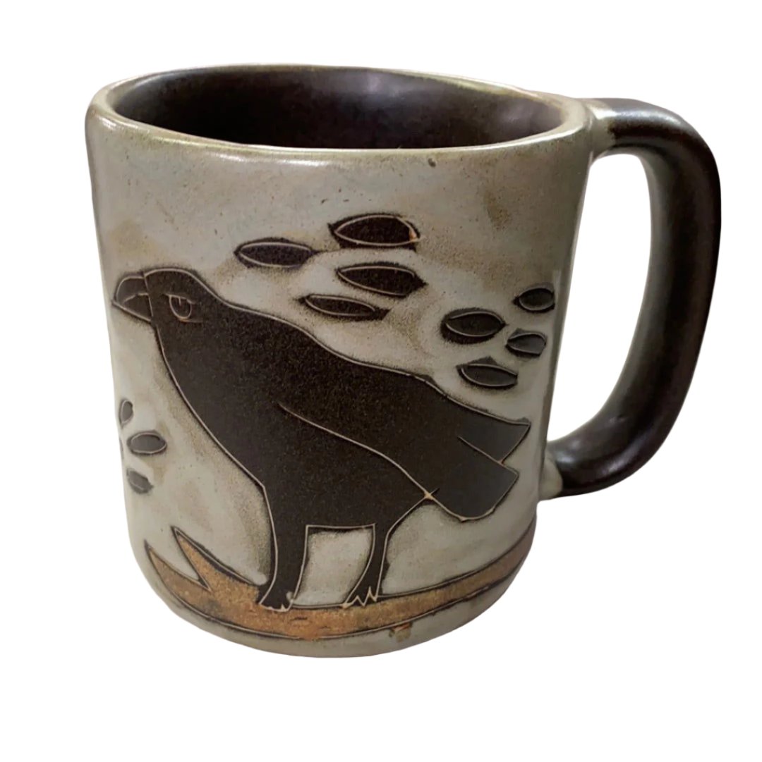 Raven Mug 16oz - Large tan and  grey pillar shape mug with iprpimitve raven standing on branch 