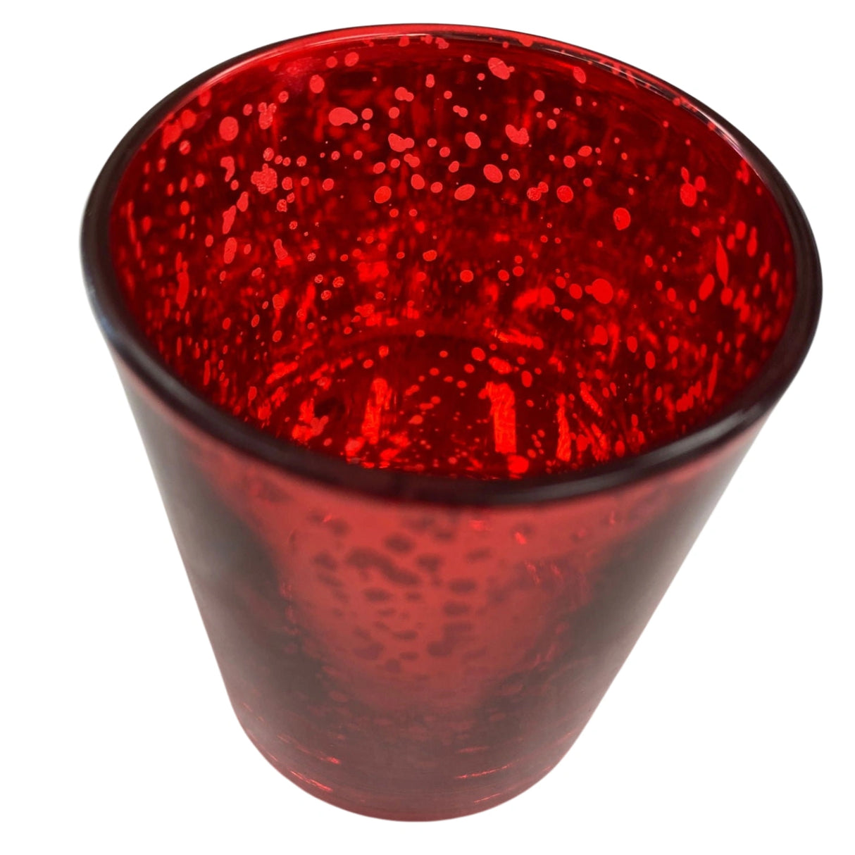 Red glass votive candle holder with a textured surface.