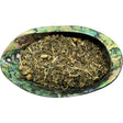 Dried Relaxing Tea Organic in an abalone shell.