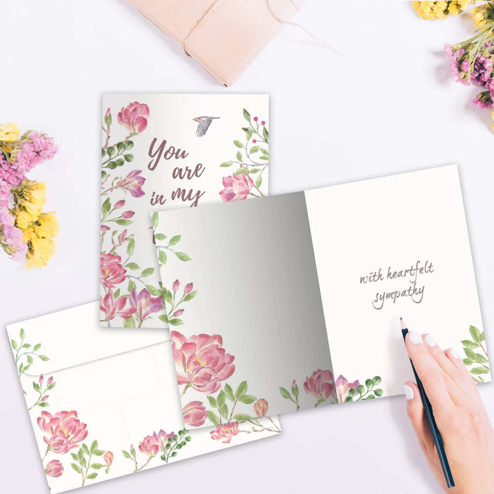 inside of card is white with same flowers and words with heartfelt sympathy 