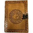 Brown leather journal with sun and moon design and brass lock.