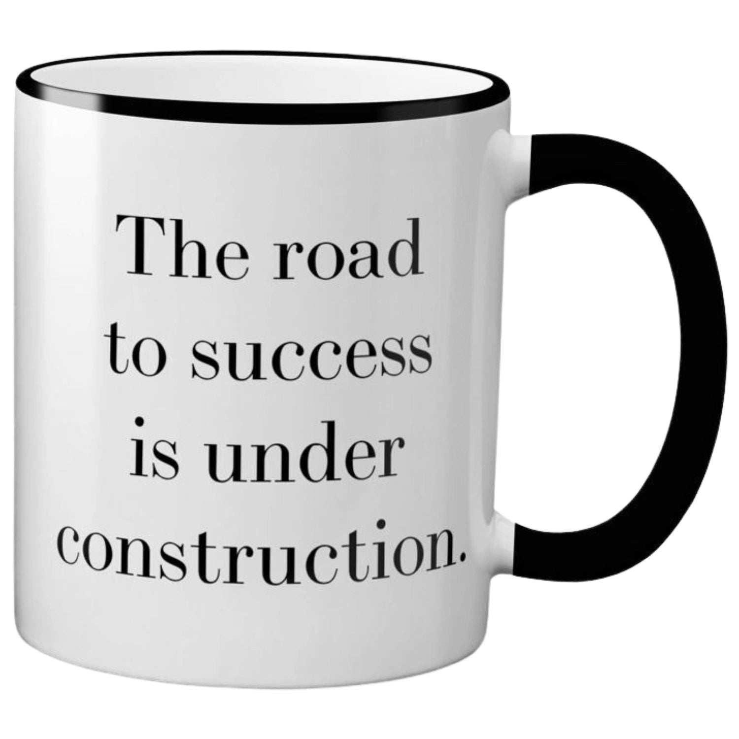  White ceramic mug with black text that reads "THE ROAD TO SUCCESS IS UNDER CONSTRUCTION." The mug has a black rim and handle.