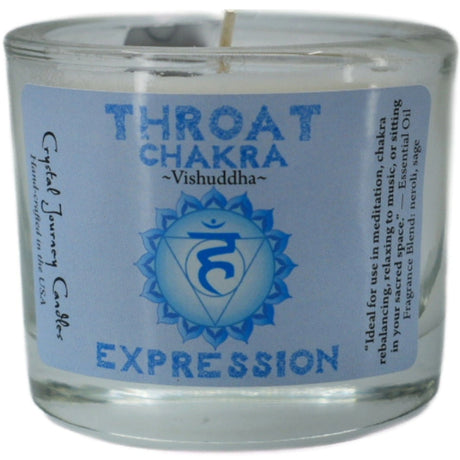 Blue votive candle with the words "THROAT CHAKRA," "VISHUDDHA," and "EXPRESSION" printed on it. The candle is surrounded by a white label with additional information about its use for meditation and chakra balancing.