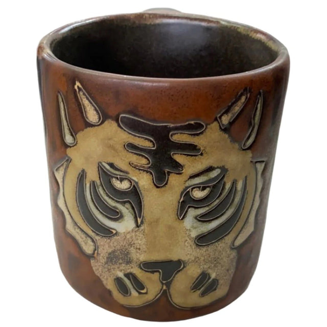 Stoneware mug with tiger design.