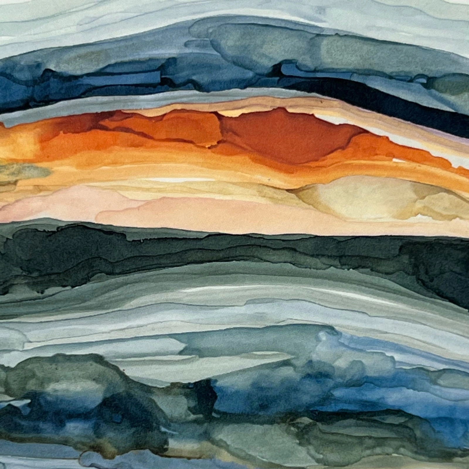 Watercolor Sunrise magnet with abstract layers of blue, orange, and yellow.