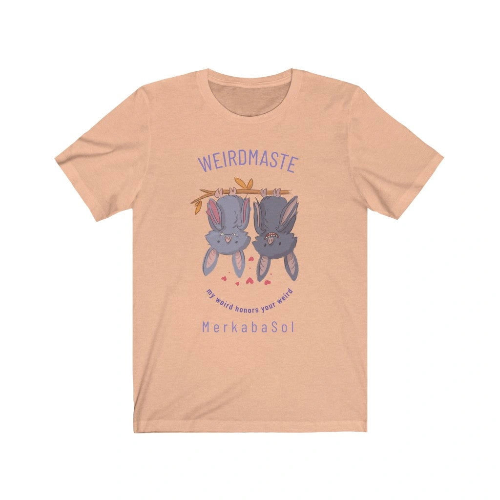 MerkabaSol Weirdmaste Short Sleeve Tee - Peach - with two bats hanging upside down and the text "Weirdmaste" and "My Weird Honors Your Weird".