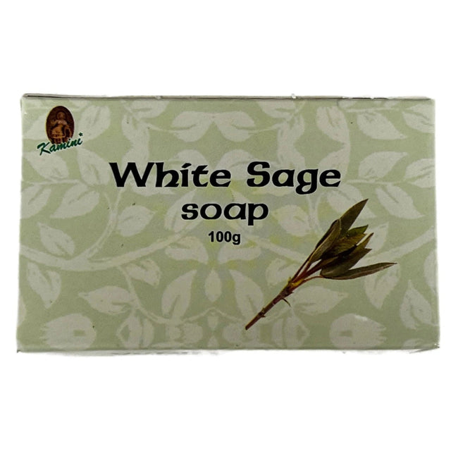 White Sage Soap bar with a white background and green sage leaves. The label reads "Kamini" and "White Sage Soap 100g."